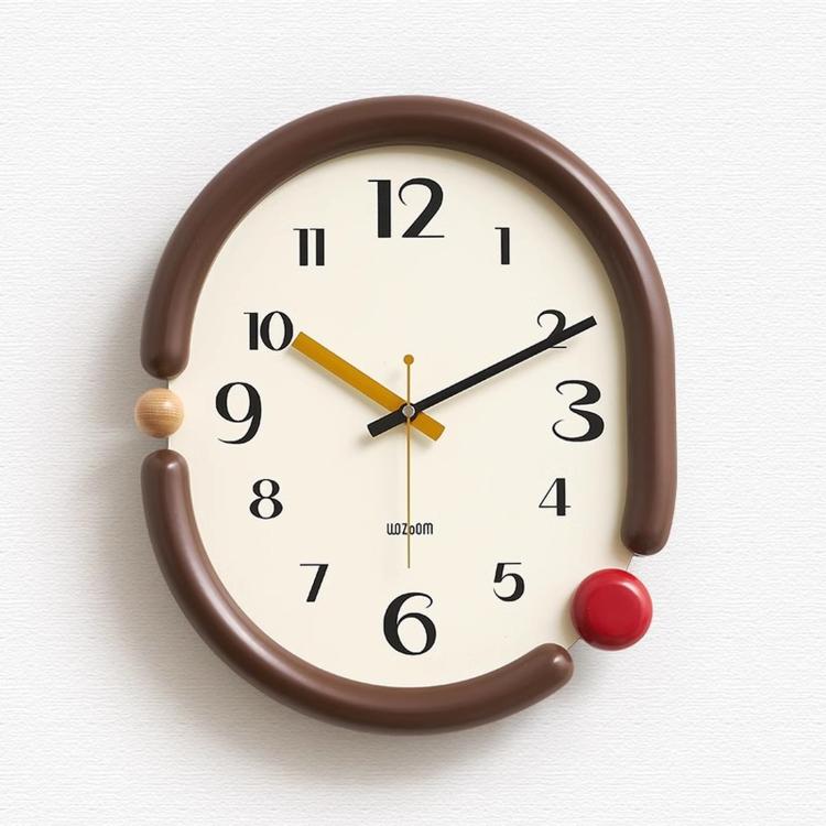 Retro oval wall clock, brown frame with black and yellow 3D hands and red knob accents