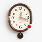 Retro oval wall clock, brown frame with gold 3D hands and black dangling tag