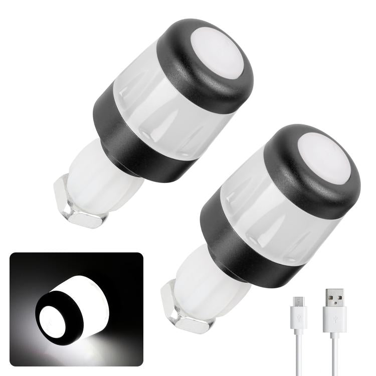 Clear-lens bike handlebar end LED light with black rubber housing and amber window