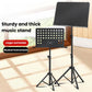 Portable folding music stand pair with black solid and perforated boards on tripod bases