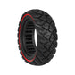 Black solid scooter tire with red sidewall stripe and blocky diamond tread.