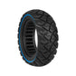 Black solid scooter tire with blue sidewall stripe and blocky diamond tread.