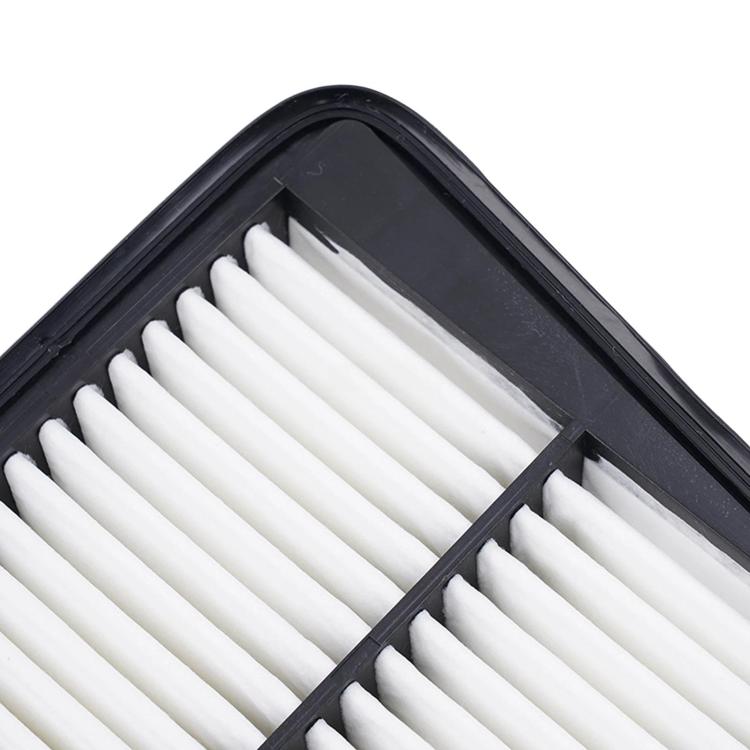 Close-up of white pleated air filter media inside black frame