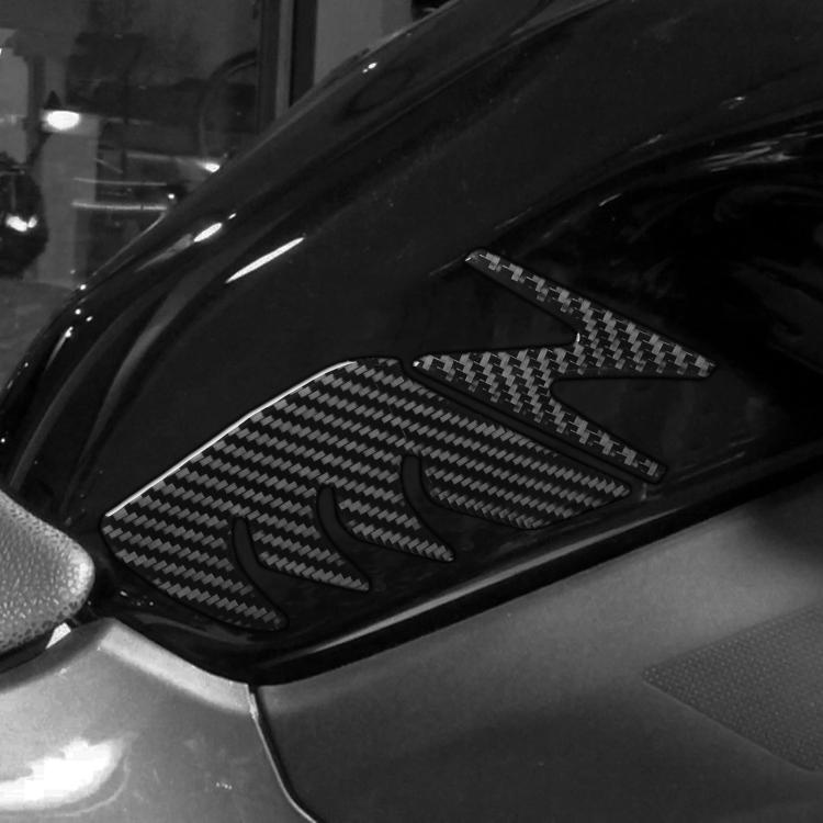 Fuel tank decorative stickers set with black carbon-fiber pattern on motorcycle panel.