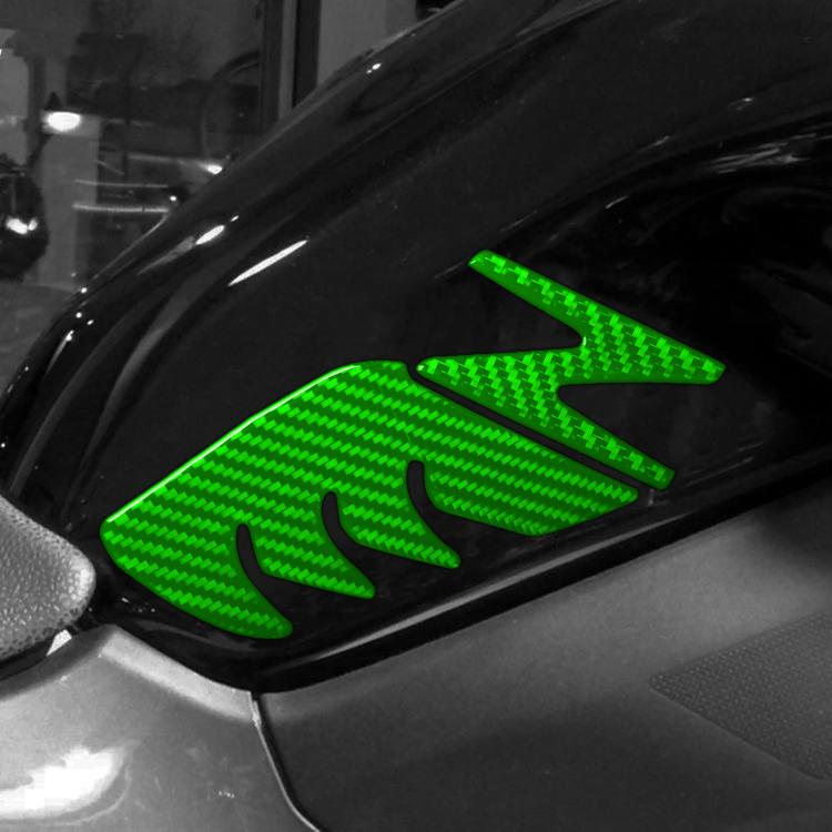 Fuel tank decorative stickers set with green carbon-fiber pattern on motorcycle panel.