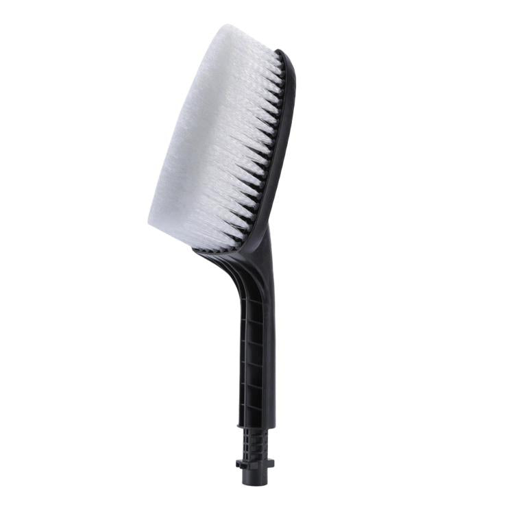Wheel cleaning brush with angled white bristle pad on black handle