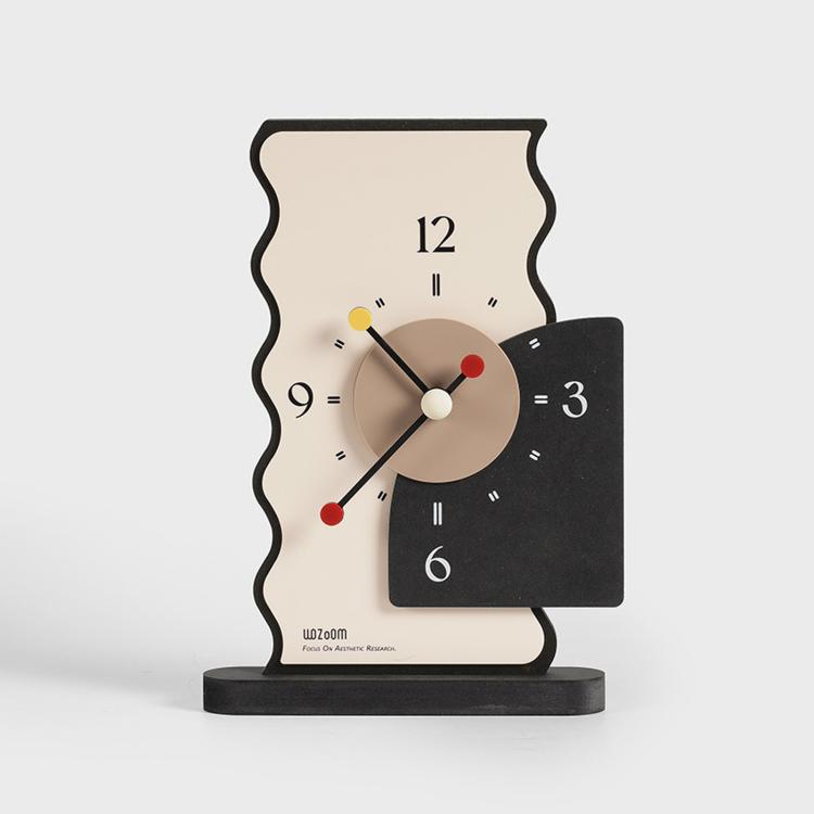 Geometric desk clock with cream back, tan dial, black panel, and multicolor hour markers