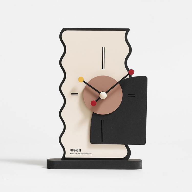 Geometric desk clock with cream back, tan dial, black panel, and multicolor hour markers