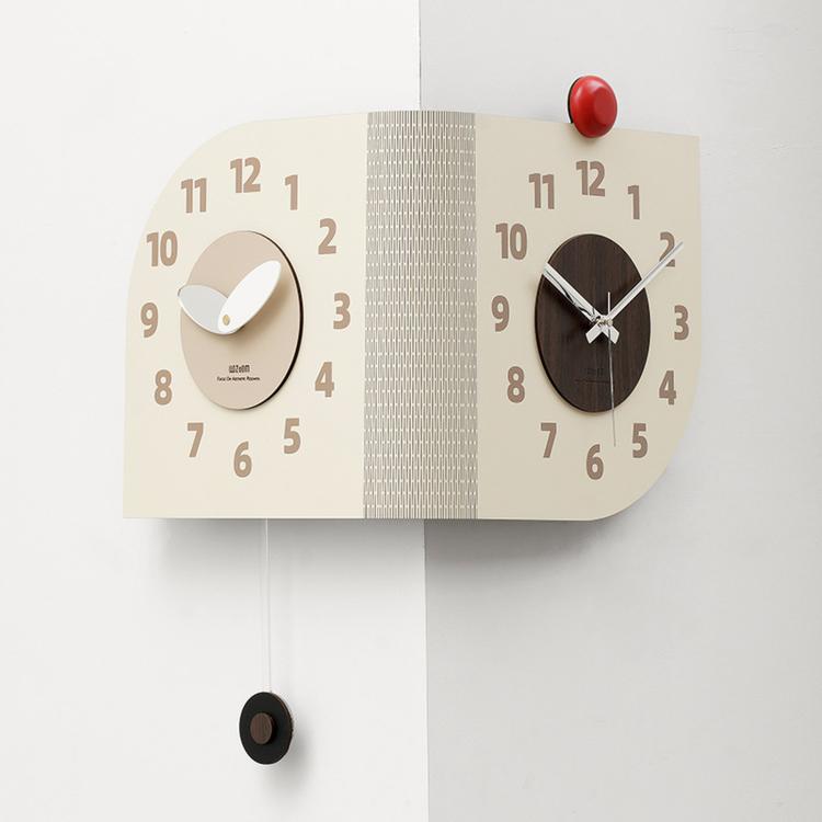 Beige dual-dial corner wall clock with round face details and red and black knobs
