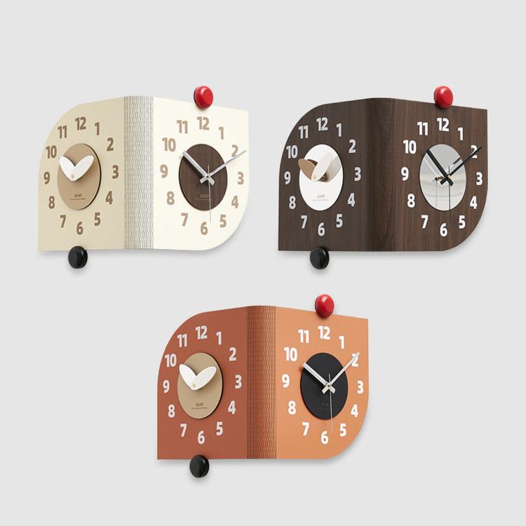 Four dual-dial corner wall clocks in beige, dark brown, and orange color options