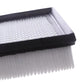 Cabin air filter edge close-up showing white pleated media and black gasket