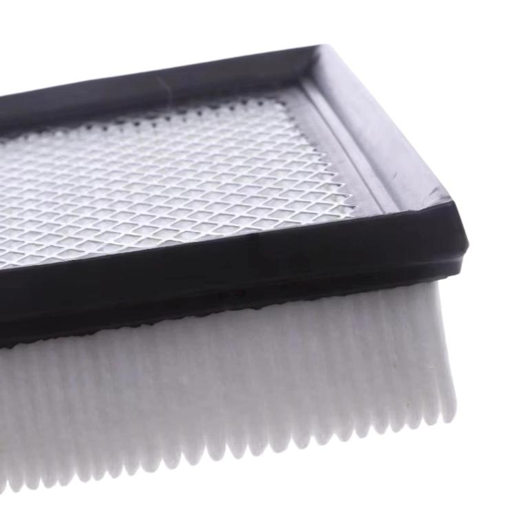 Cabin air filter edge close-up showing white pleated media and black gasket