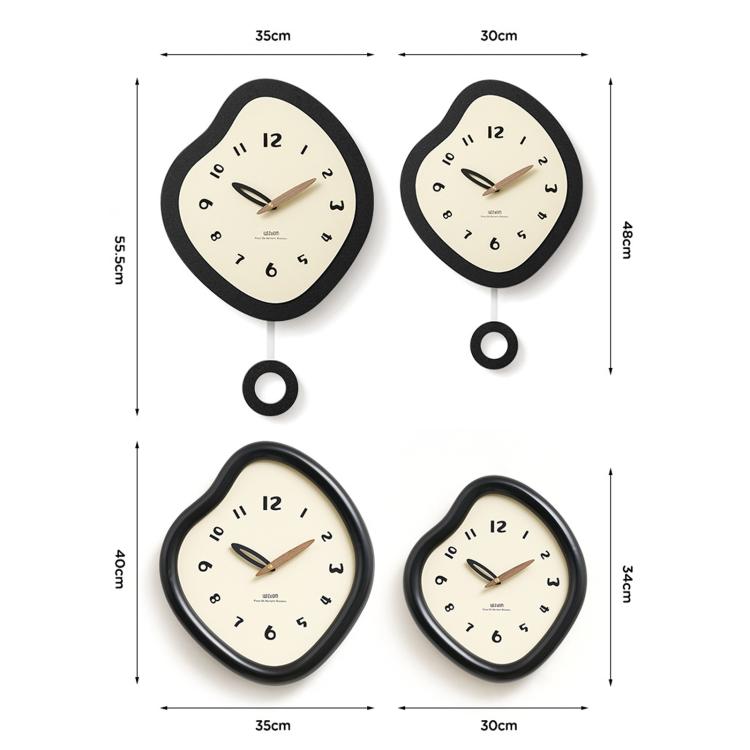Set of irregular black wall clocks with cream dials and walnut hands, shown with dimensions
