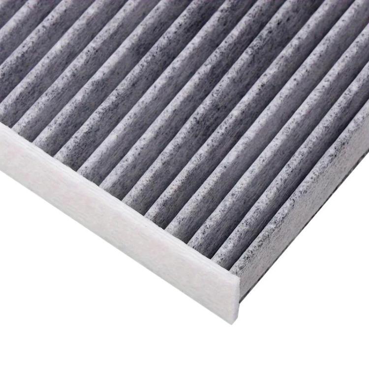 Car air filter element close-up of gray pleated filter media in white frame