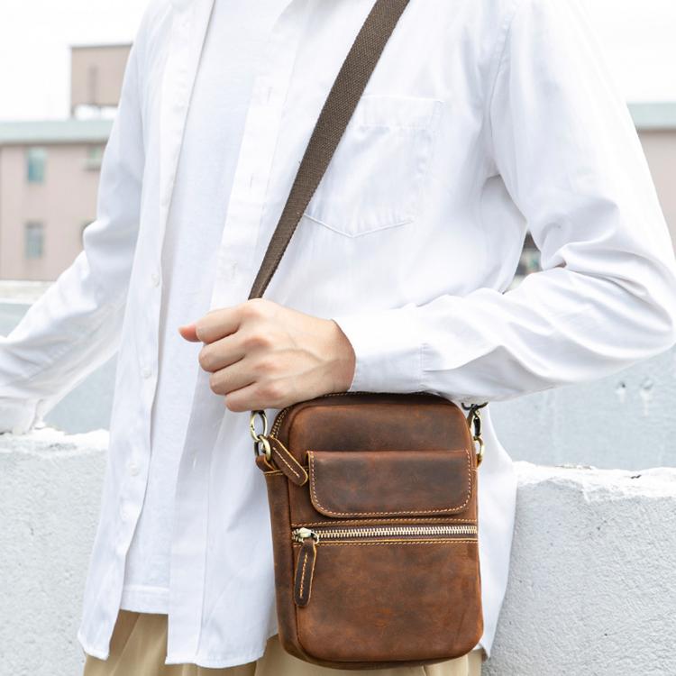 Small vintage leather crossbody bag in brown, front flap and zip with adjustable strap