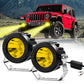 Pair of black round LED spotlights with yellow lens covers and silver mounting brackets