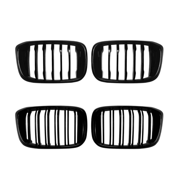 Set of black oval grille inserts shown as four pieces with vertical slats