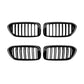 Set of four black oval grille inserts with vertical slat openings
