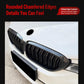 Front bumper grille insert with black vertical slats and chrome-style edge trim