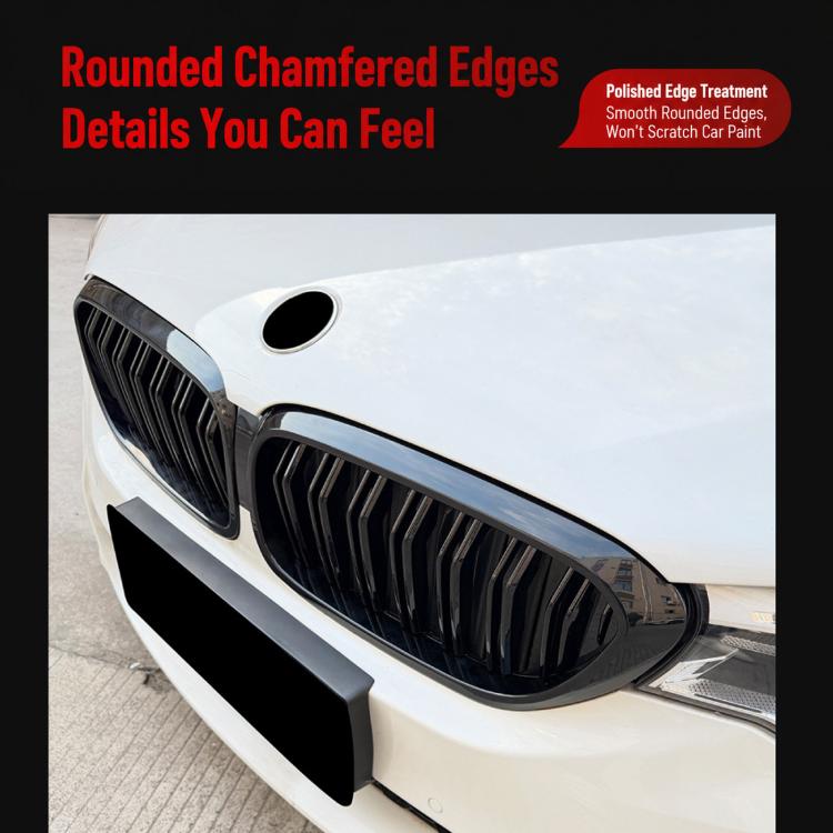 Front bumper grille insert with black vertical slats and chrome-style edge trim