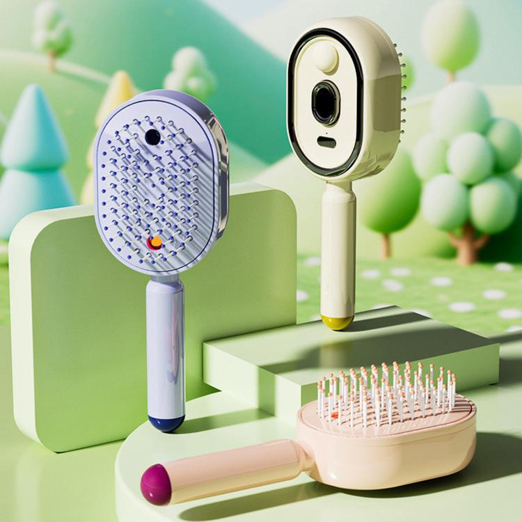 Cream electric hair spray massage brush with round bristle head and mist outlet