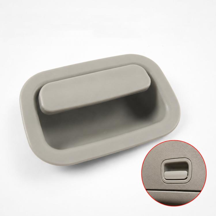 Light gray interior door handle with rectangular push button
