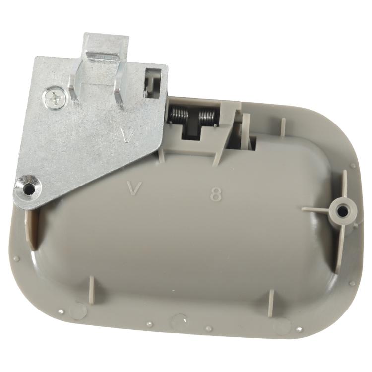 Light gray interior door handle with exposed internal latch assembly