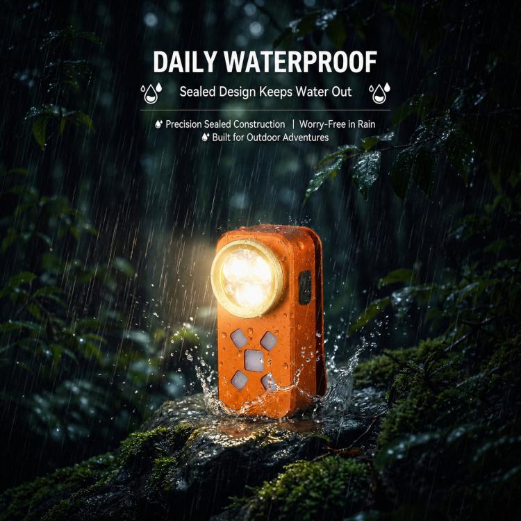 Orange waterproof LED emergency light glowing in rain with water splashes