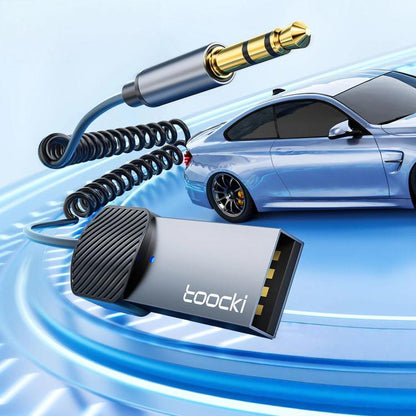 Car Bluetooth aux audio receiver adapter with silver/gray body and 3.5mm gold plug