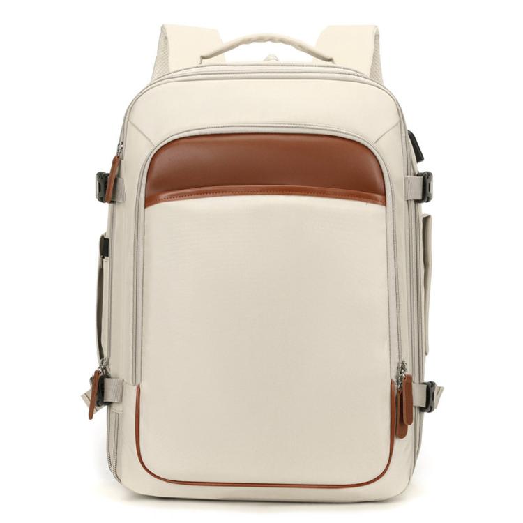 Beige expandable travel backpack with front pocket and top handle, brown trim