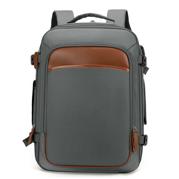 Gray expandable travel backpack with front pocket and top handle, brown trim