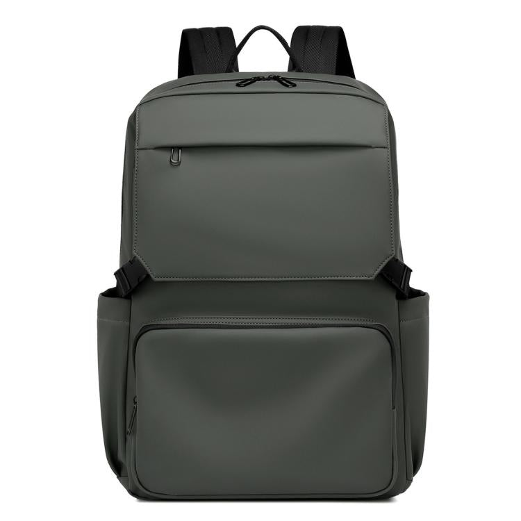 Green laptop backpack with zip front, top handle, and padded shoulder straps