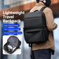 Black laptop backpack worn on the back, with front zip pocket and top handle