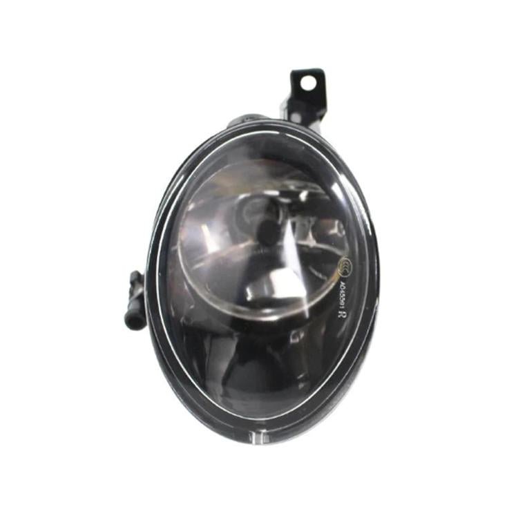 Front bumper fog light with clear lens and black housing, close-up view