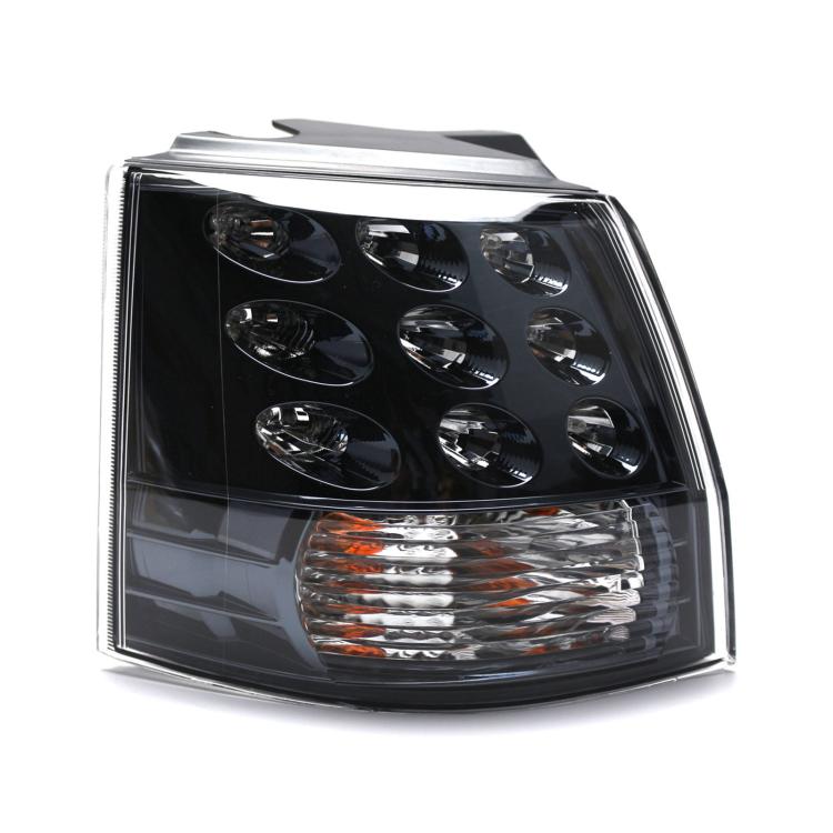 Rear tail light lamp with clear lens, black housing, chrome reflectors, amber strip