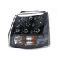 Rear tail light lamp with clear lens, black housing, chrome reflectors, amber strip