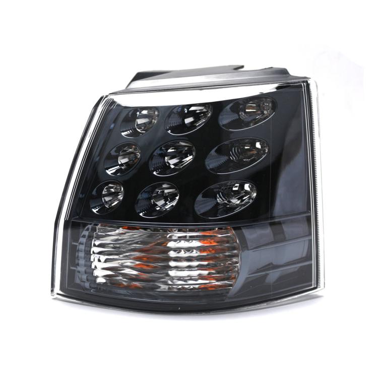 Rear tail light lamp with clear lens, black housing, chrome reflectors, amber strip