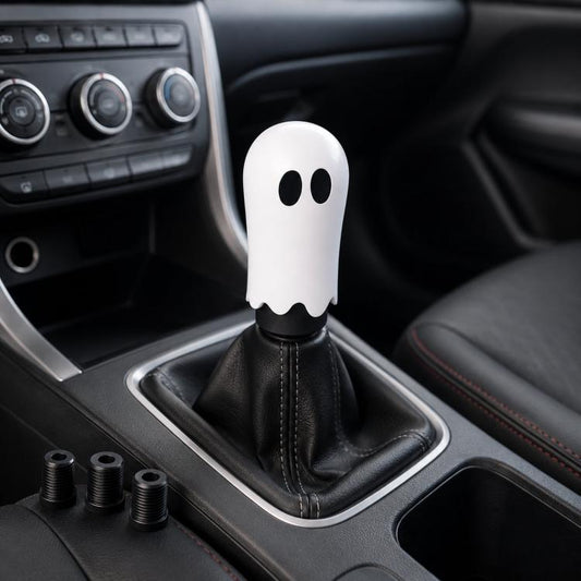 White ghost car gear shift head decoration with two black eye openings and wavy bottom