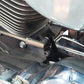 Black speed adjustment assist bracket mounted on motorcycle near engine