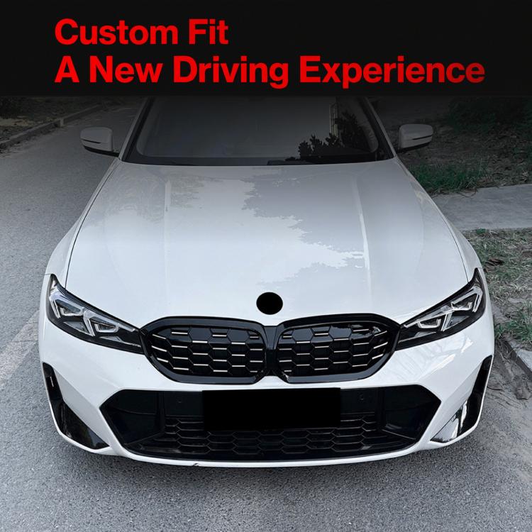 BMW front grille installed, black honeycomb mesh on a white sedan