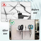 White acrylic wall-mounted scissor holder with attached scissors, combs, and clips