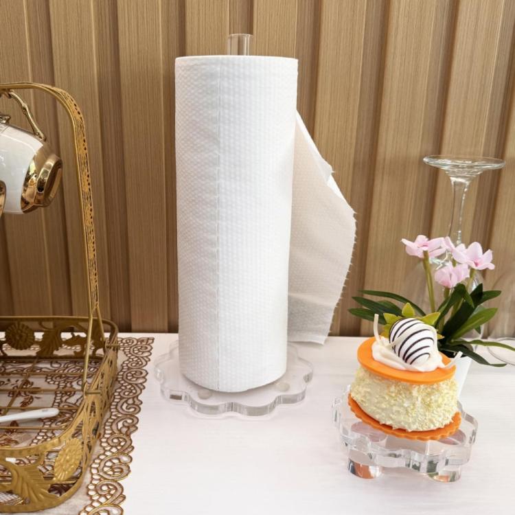 Clear acrylic paper towel holder with white paper roll and transparent scalloped base
