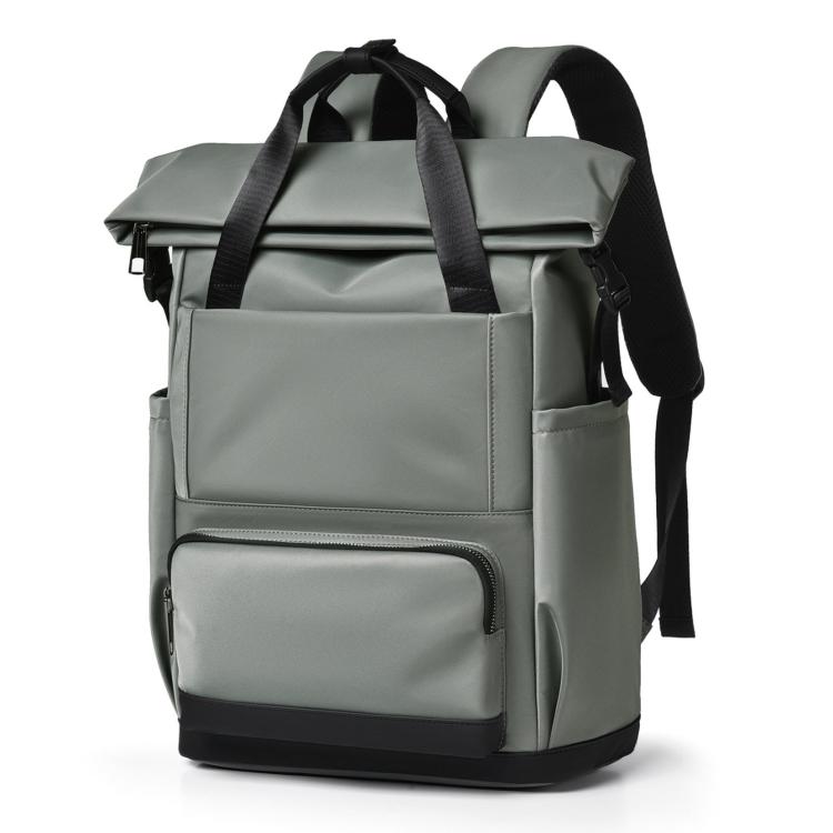 Green laptop backpack with padded front pocket and top carry handle