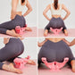 Pink pelvic floor trainer in use on home exercise mat during glute training