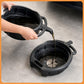 Oil drain pan filling with fluid, black plastic basin with handles and pour spout