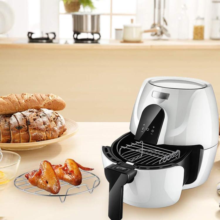 White air fryer with a black grill rack accessory inside