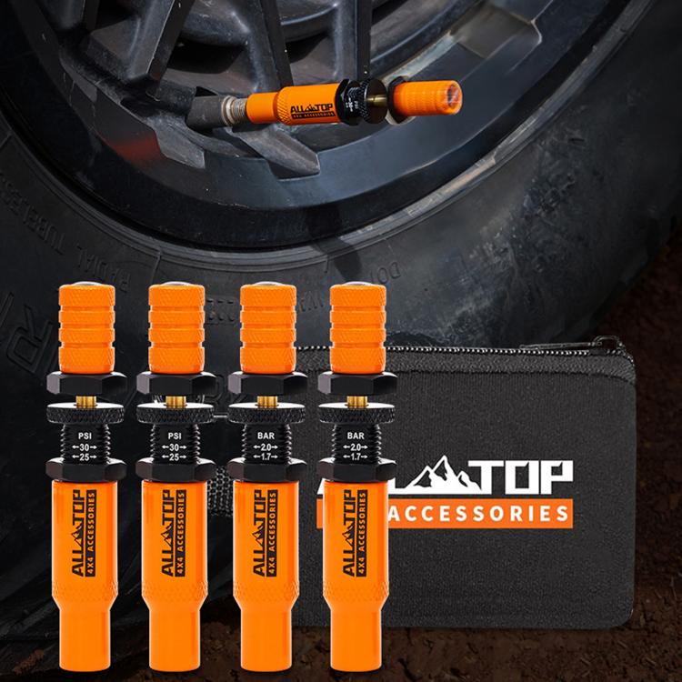 Orange tire deflator valve kit with preset PSI/BAR tools and black accessories case