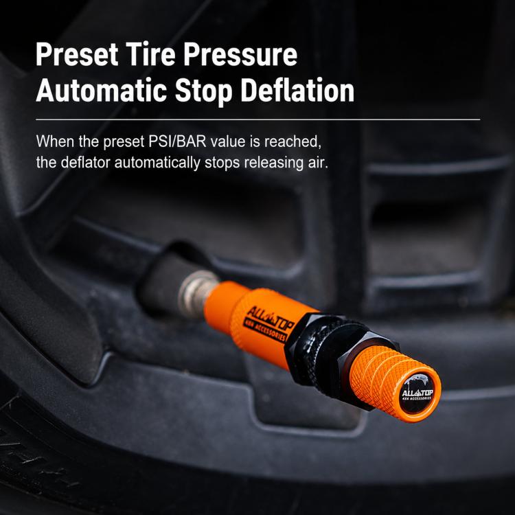 Orange auto-stop tire deflator attached to a tire valve with black connector