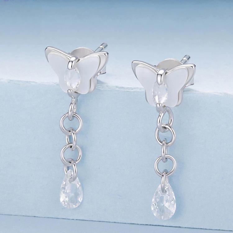 Butterfly stud earrings with crystal teardrop drops and linked chain tassels