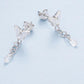 Butterfly stud earrings with hanging teardrop crystal charm and linked chain tassels